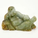 Chinese Carved Jade Resting Buddha Figurine. Light to dark green with amber color splashes.