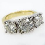 3.10 Carat Round Brilliant Cut Diamond and 18 Karat Yellow and White Gold Three Stone Ring Set