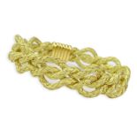 18 Karat Yellow Gold Four Strand Woven Rope Bracelet. Unsigned, tested. Good condition. Measures