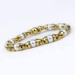 Bulgari 18 Karat Yellow Gold and Pearl Link Bracelet. Pearls measure 8mm. Signed, stamped 750,