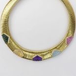 Vintage Cartier 18 Karat Yellow Gold And Carved Multi Gemstone Necklace. The diamonds and colored
