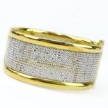 Finely Crafted Italian 18 Karat Yellow and White Gold Hinged Bangle Bracelet. Stamped Italy, 18K and