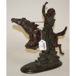 A modern resin figure of a native American on horseback