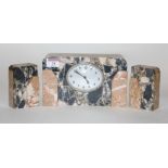 An Art Deco veined marble cased three-piece clock garniture