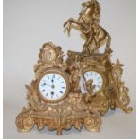 A late 19th century French gilt metal cased mantel clock having an enamel dial with Roman numerals