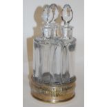 A set of three Italian heavy glass decanters and stoppers,