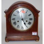 An early 20th century mahogany cased mantel clock by Gustav Becker having a silvered dial with