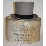 An early 20th century grey top hat bearing a label for Moss Bros with associated 'Dunn & Co.