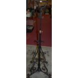 An early 20th century black painted wrought iron telescopic paraffin lamp stand (lacking fittings)