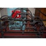 A Victorian black painted wrought iron three quarter size bedstead,