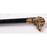 An ebony walking cane, having cast bronze hounds head handle set with blue sapphire eyes,