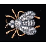 A Victorian style yellow metal and diamond set brooch as a fly, the body,