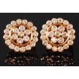 A pair of yellow metal and diamond cluster ear studs,