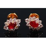 A pair of yellow metal, ruby and diamond set ear studs,