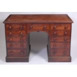 A 19th century mahogany kneehole desk in the manner of Holland & Sons,