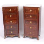 A pair of Continental walnut and marquetry inlaid five drawer chests,