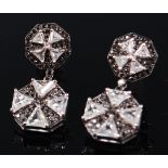 A pair of 18ct white gold, diamond and black diamond set ear studs,