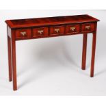 A mahogany and crossbanded five drawer side table, in the early George III style,