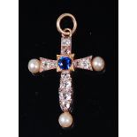 A Victorian white metal and yellow metal tipped pendant in the form of a cross,