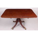 A circa 1830 plum pudding mahogany and crossbanded round corner tilt-top pedestal supper table,