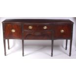 A late 19th century mahogany serpentine front sideboard,