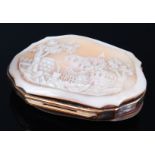 A late Victorian carved shell cameo mounted evening purse, having silk lined interior,