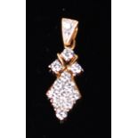 A modern yellow metal diamond set lozenge pendant, set with twelve small brilliants,