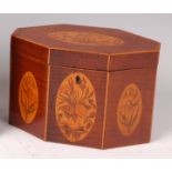 A late Georgian fiddleback mahogany and marquetry inlaid tea caddy, of shaped octagonal form,