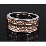 A contemporary heavy 18ct white gold half eternity ring,