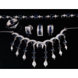 A contemporary 14ct white gold, sapphire and diamond set five piece garniture, comprising; necklet,