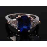 An 18ct white gold, tanzanite and diamond ring,