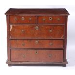 A circa 1700 oak and figured walnut chest, of two short over three long drawers,