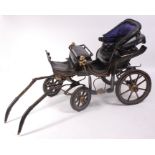 A Victorian childs barouche toy carriage, having studded leather seat with folding leather hood,