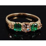 A yellow metal, emerald and diamond ring, the centre old brilliant cut diamond weighing approx 0.
