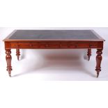 A Victorian mahogany library table, having a tooled leather inset top above six frieze drawers,