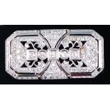 An Art Deco white metal diamond set brooch, of pierced rectangular form with canted corners,