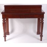 An early Victorian mahogany servery, having twin blind frieze drawers,