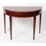 A George III mahogany and crossbanded demi-lune card table,