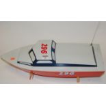 A radio controlled model of a speedboat