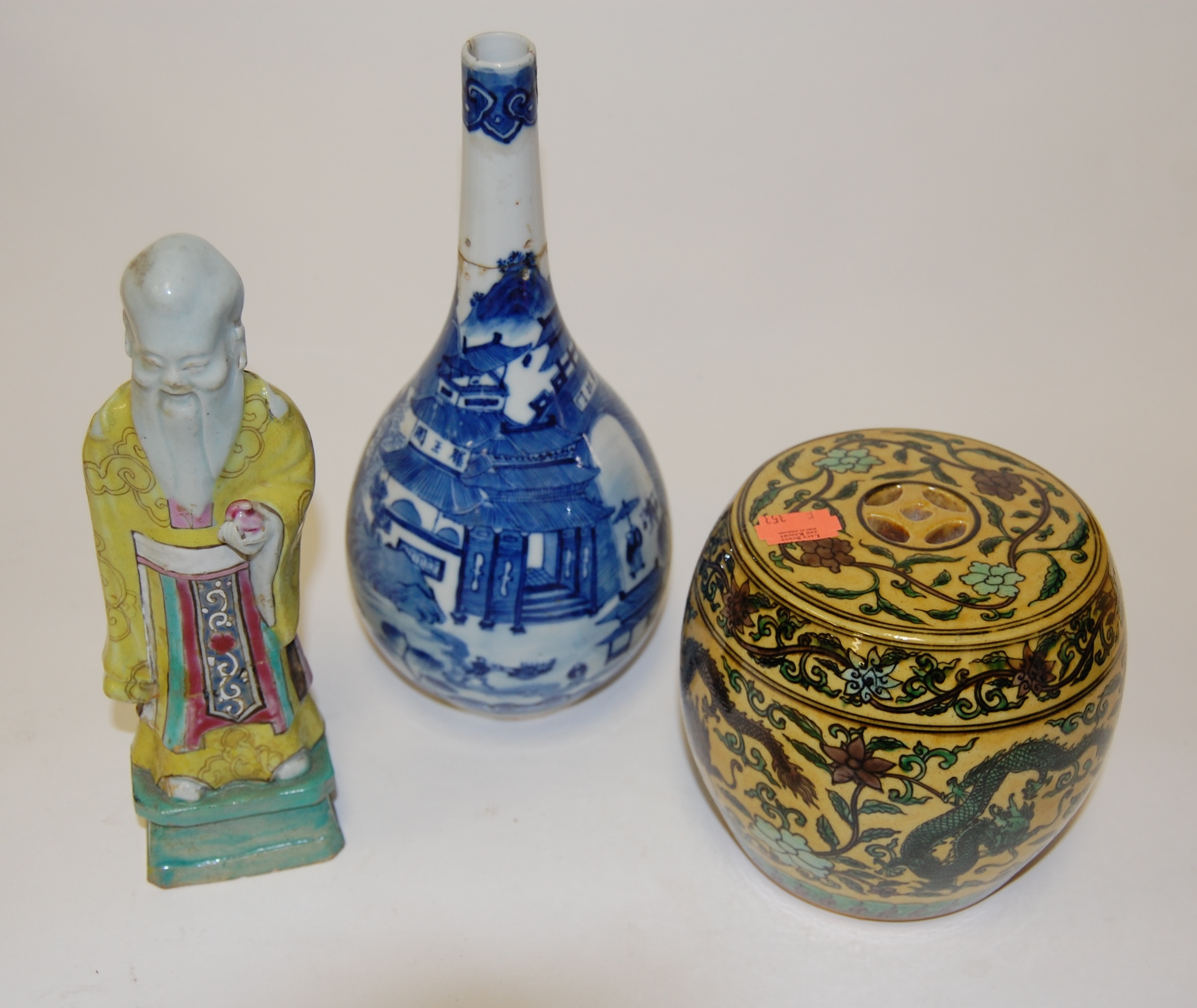 A Chinese export blue and white bottle vase, typically decorated with figures amongst landscapes,