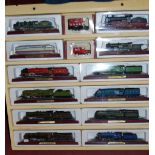 A quantity of various collectable model locomotives in an associated wooden display case