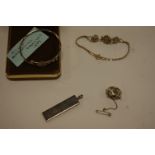 A late Victorian silver christening bangle, silver pendant,