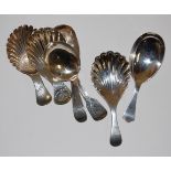 A collection of circa 1830 and later silver caddy spoons to include three examples with shell