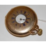 A gold plated gents half hunter pocket watch having keyless movement,