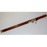 An early 20th century bamboo and white metal mounted opium pipe