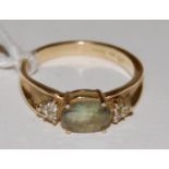 A 9ct gold peridot and diamond set dress ring,