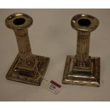 A pair of late Victorian silver column dwarf table candlesticks by William Hutton & Sons Ltd,