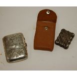 An engine turned silver pocket cigarette case, silver and engraved pocket cigarette case,