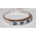 An 18ct white gold sapphire and diamond set ring arranged as alternating square cut sapphires and