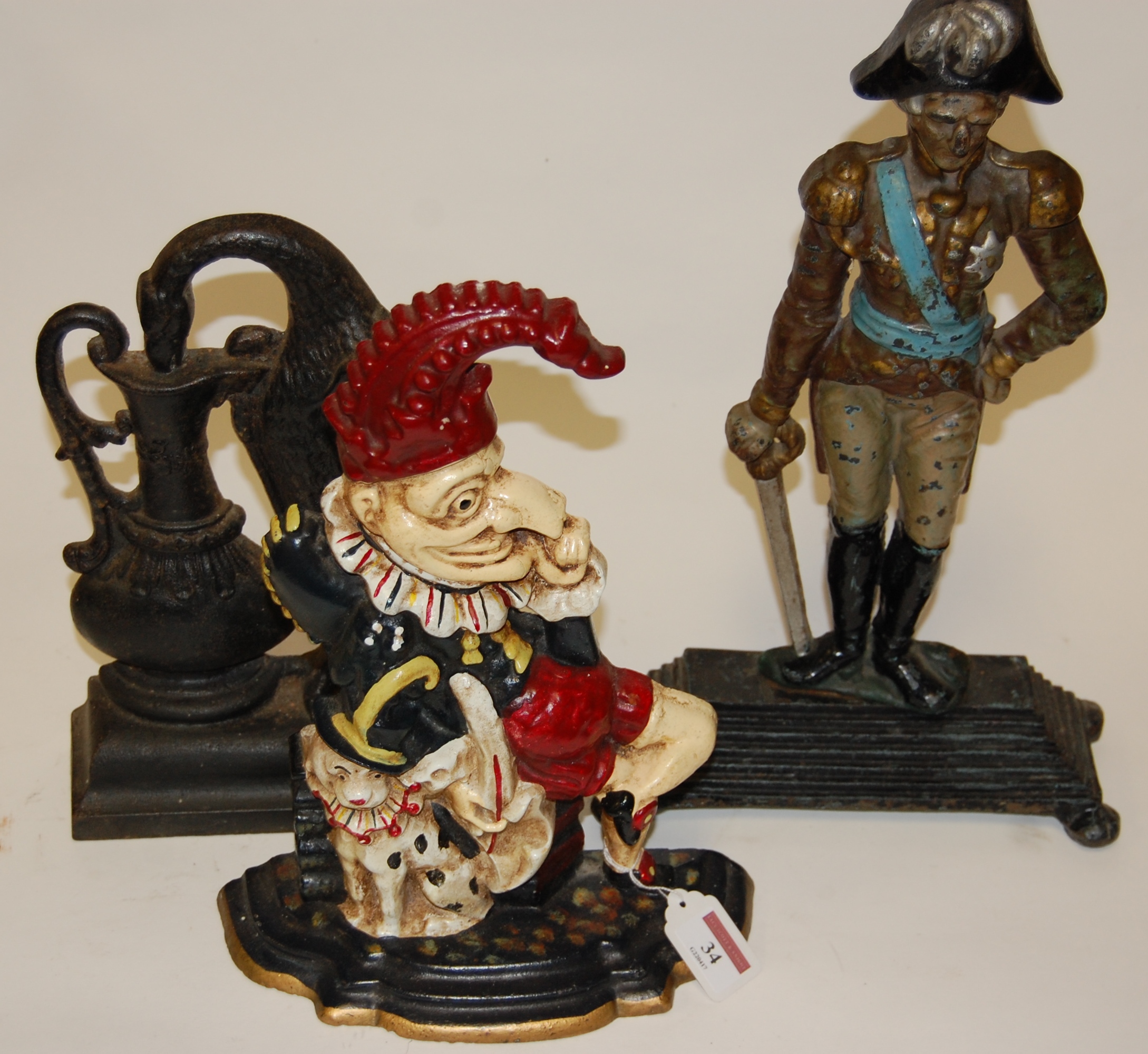 A reproduction painted cast iron doorstop in the form of Admiral Nelson together with a painted